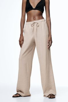 Daywear Straight Pants With Pockets, Straight Pants With Pockets For Daywear, Casual Wide Leg Belted Pants, Casual High-waisted Pants With Belted Cuffs, Belted Cuffs Straight Pants, Belted Cuff Trousers, Relaxed Fit High-waisted Pants For Daywear, Casual Spring Bottoms With Belted Cuffs, Straight Leg Pants With Pockets For Daywear