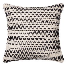 a black and white pillow on a white background