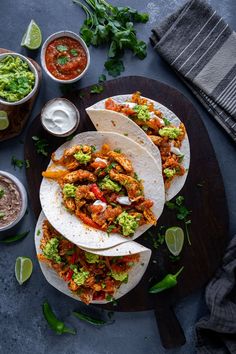 three chicken tacos with guacamole and salsa