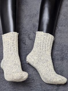 Hand-Knitted Women's Winter Socks in grey and white - Cozy Wool Blend Brighten your winter days with these hand-knitted women's socks, crafted in a charming grey and white color combination. Made from a soft, wool blend, these socks are perfect for keeping your feet warm and snug during chilly weather. Whether you're relaxing at home or layering up for outdoor adventures, their cozy design ensures ultimate comfort and style. Each pair is lovingly hand-knitted, making them a unique, one-of-a-kind addition to your wardrobe or a thoughtful gift for someone special. Stay warm, stylish, and comfortable with these colorful winter essentials! Cozy Design, Winter Socks, Women's Socks, Relaxing At Home, Chilly Weather, Winter Essentials, Winter Colors, Casual Socks, Winter Days