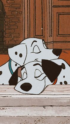 two dalmatian dogs laying on the floor next to each other