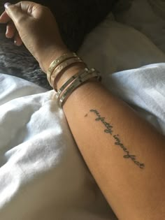 a woman's arm with a tattoo that reads, i love you mom on it