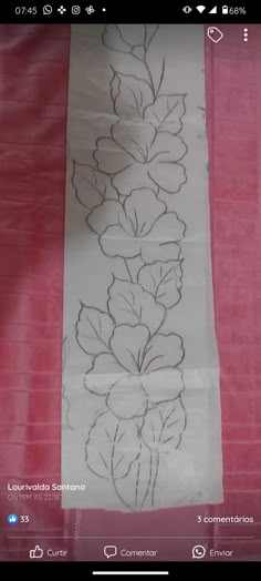 a piece of paper with flowers drawn on it