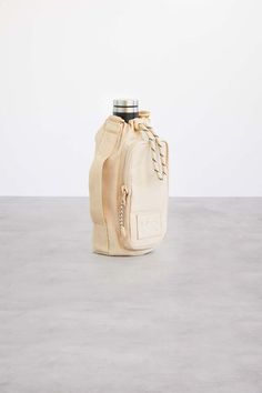 The Water Bottle Sling in Beige | Béis Water Bottle Sling, Bottle Sling, Water Bottle Bag, Something Nice, Water Bottle Holders, Water Bottle Design, Travel Work, Small Handbag, Wallet Pattern