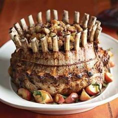 a plate topped with food on top of a wooden table