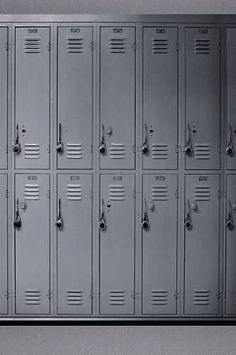 a bunch of lockers are lined up against the wall