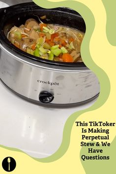 a crock pot filled with vegetables on top of a stove