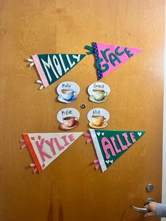 a door decorated with magnets that say hello kitty and have name tags attached to them