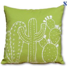 a green pillow with a cactus design on the front and side, sitting on a white background