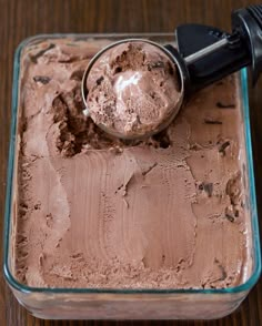 a scoop of ice cream in a glass dish