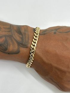 This is a 14K Yellow Gold Miami Cuban bracelet with 6.5-6.7mm links. It's made in a 14K gold semi-hollow style, which means you can still have the big bold look the Miami Cubans are well-known for but without the huge price tag. It's perfect for everyday wear. Great size for both men and women. Please be mindful of the bracelet length for those with smaller wrists. Be sure to measure wrist or ankle before purchasing.   ~ Approximately 6.5-6.7mm wide  ~ Real 14K yellow gold  ~ Semi-hollow/semi-so Cuban Link Bracelet Men Gold, Cuban Bracelet, Father Time, Miami Cuban Link Chain, Wrist Jewelry, Mens Gold Bracelets, Miami Cuban, Linking Rings, Men's Bracelet