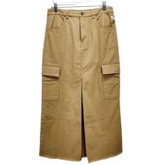 This Steve Madden Cargo Midi Skirt Combines Style And Functionality With Its Durable Cotton-Elastane Blend. Its Mushroom Hue And Practical Cargo Pockets Offer A Fashionable Yet Utilitarian Look. The Skirt's Medium Size Ensures A Comfortable Fit For Various Body Types, While The Front Slit And Raw Hem Add A Trendy Touch. Ideal For Casual Outings And Versatile Wardrobe Pairings. Cargo Pockets Front Slit Raw Hem Made In India Button And Zip Closure Durable Cotton-Elastane Blend Top To Bottom = 32 I Cargo Midi Skirt, Cotton Skirt, Medium Brown, Stripe Print, Brown Color, Size Clothing, Medium Size, Steve Madden, Maxi Skirt