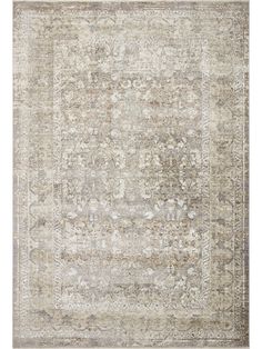 an antique style rug in grey and beige tones