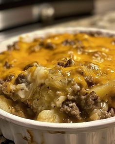 a casserole dish with cheese and ground beef