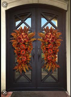 two autumn wreaths on the front door