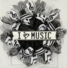 i love music wreath with musical notes and trebles on the front door frame