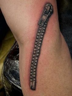 a tattoo on the leg of a person with a phone in it's arm