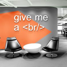 an office with chairs, tables and a sign that says give me a b / r