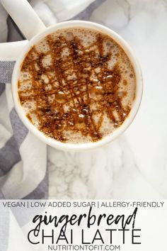 an overhead view of a cup of gingerbread chai latte