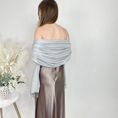 Our new metallic pashmina's are extremely soft and will keep your bridesmaids or guests warm and stylish at your wedding reception. They are great keepsake items for your bridesmaids or wedding guests as they are high quality. With how brilliantly sparkly they are, the bride can even use this as a way to stand out from the bridesmaids! Please make sure to purchase a sample if you are placing a large order to insure quality and color expectations are met. Materials: 70% Pashmina/30% Silk Dimensio Elegant Winter Formal Pashmina Shawl, Elegant Winter Pashmina Shawl For Formal Occasions, Elegant Fall Pashmina Shawl, Elegant Solid Color Shawl For Fall, Elegant Shawl For Formal Fall Events, Elegant Solid Color Fall Wraps, Elegant Fall Party Scarf, Elegant Fall Party Scarves, Elegant Wedding Pashmina Scarves