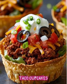 taco cupcakes are topped with sour cream and black olives