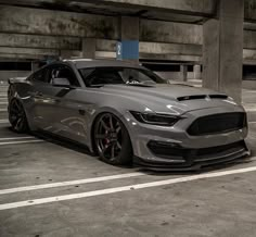 a grey car parked in a parking garage