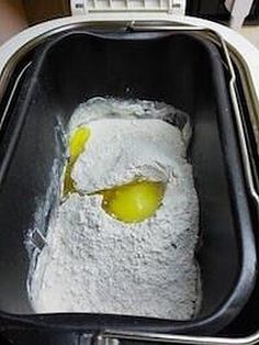 a pan filled with flour and eggs on top of a counter