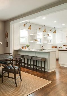 an open kitchen and dining room with hardwood floors