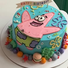 a spongebob birthday cake on a white plate