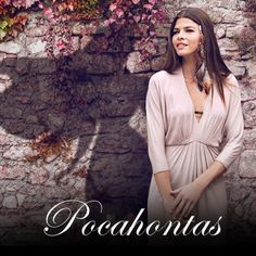 a woman standing in front of a stone wall with the words pocahontass on it