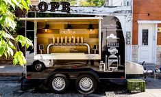 a food truck parked in front of a brick building