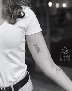 a woman with a tattoo on her arm