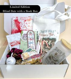 a white box filled with assorted items and the words limited edition blnd date with a book box