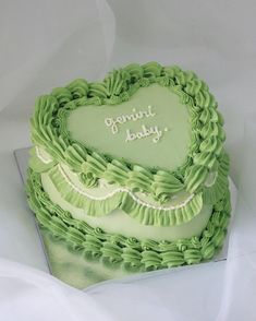 a heart shaped cake with the words forward baby written in frosting on it's side