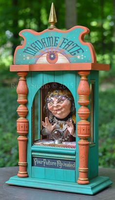 a wooden clock with an image of a woman on it