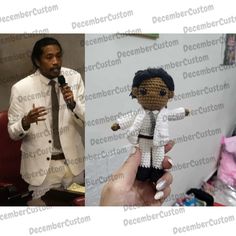 a man holding a microphone next to a crocheted doll