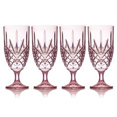 three wine glasses sitting next to each other