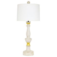 a white and gold lamp with a white shade