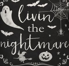 a chalkboard sign that says livin the nightmares with halloween decorations and bats on it