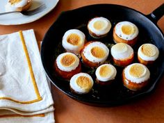 some food is cooking in a pan on the table