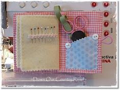 a sewing kit with pins and needles on it