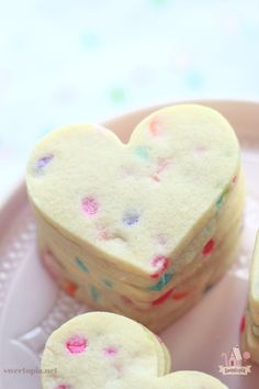 some heart shaped cookies on a plate