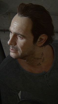 a man with a tattoo on his neck looking off into the distance