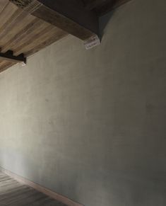 an empty room with wooden floors and walls