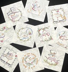 six christmas cards with snowmen and wreaths on them, all in different designs