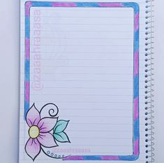 a spiral notebook with a flower on the front and writing paper in the back side