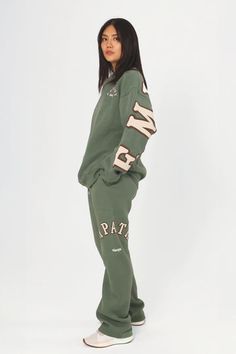 Empathy Always Olive Sweatpants – The Mayfair Group LLC Fall Athleisure Sweats With Side Pockets, Athleisure Sweats With Side Pockets For Fall, Oversized Cotton Joggers For Fall, Oversized Joggers With Elastic Waistband For Fall, Fall Lounging Sweats Sportswear, Fall Athleisure Tracksuit With Side Pockets, Relaxed Fit Tracksuit With Ribbed Cuffs For Fall, Oversized Sportswear Sweatpants For Leisure, Cozy Cotton Tracksuit For Fall