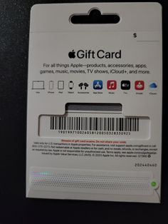 an apple gift card sitting on top of a table