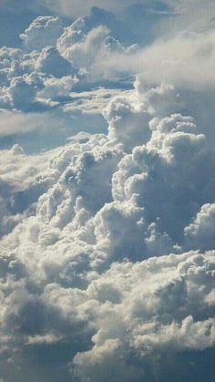 the sky is filled with lots of white clouds and blue skies are visible in the background