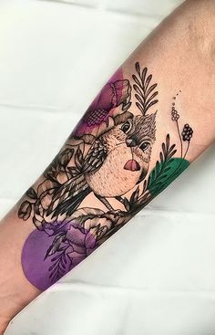 a tattoo on the arm of a person with flowers and leaves around her body,